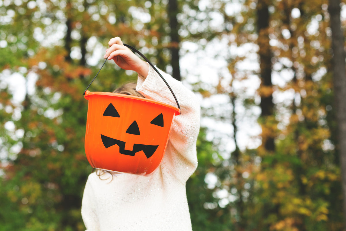 child-holding-jack-o-lantern.jpg